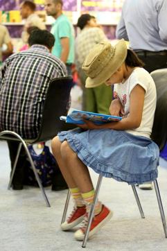 A child engrossed in reading at the Delhi Book fair last year. (Prabhas Roy/HT)