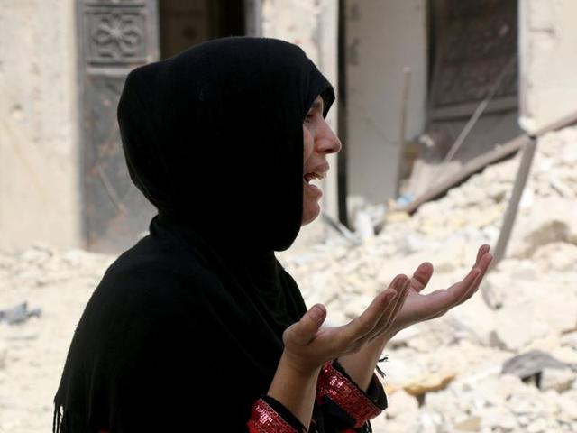 A Syrian woman reacts following a reported barrel bomb attack on the Bab al-Nairab neighbourhood of the northern Syrian city of Aleppo on August 25. (AFP) A Syrian woman reacts following a reported barrel bomb attack on the Bab al-Nairab neighbourhood of the northern Syrian city of Aleppo on August 25. (AFP)