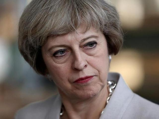 Pro-Brexit supporters hold up placards as they demonstrate outside Downing street in London.(AFP)