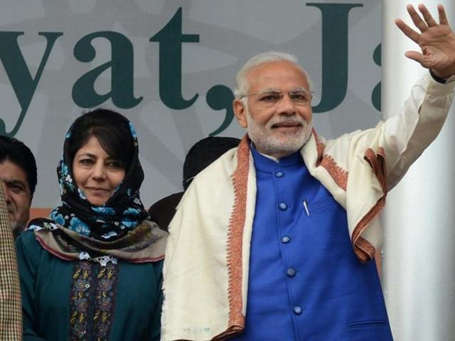 In this photograph taken on November 7, 2015, Prime Minister Narindra Modi and Peoples Democratic Party leader Mehbooba Mufti greet supporters at a public rally in Srinagar. (AFP File Photo) In this photograph taken on November 7, 2015, Prime Minister Narindra Modi and Peoples Democratic Party leader Mehbooba Mufti greet supporters at a public rally in Srinagar. (AFP File Photo)