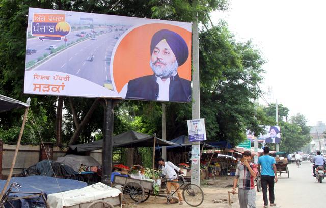 Flex boards installed by the government for advertising world-class road infrastructure provided by it in the city. (JS Grewal/HT Photo)