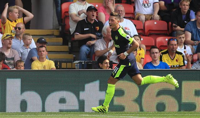 Arsenal's Mesut Ozil celebrates after scoring his side's third goal. (AP Photo) Arsenal's Mesut Ozil celebrates after scoring his side's third goal. (AP Photo)