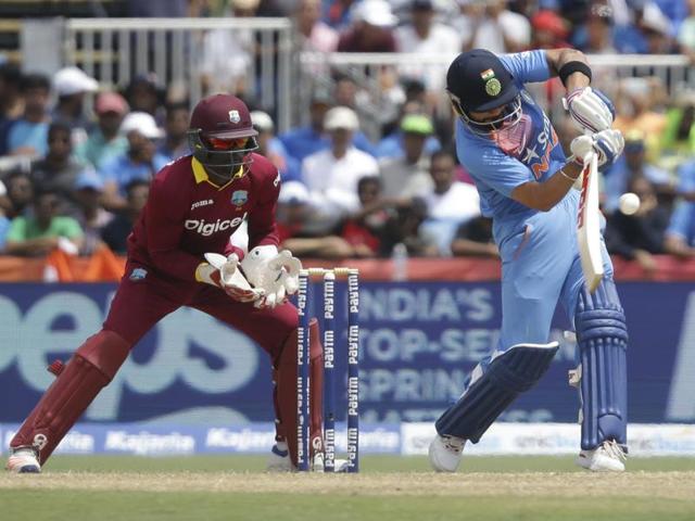 India's Virat Kohli, right, plays a shot as West Indies' Andre Fletcher looks on. (AP Photo) India's Virat Kohli, right, plays a shot as West Indies' Andre Fletcher looks on. (AP Photo)