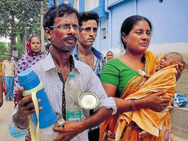 A baby is rescued after a major fire broke out at Murshidabad Medical College and Hospital in West Bengal on Saturday.(PTI)