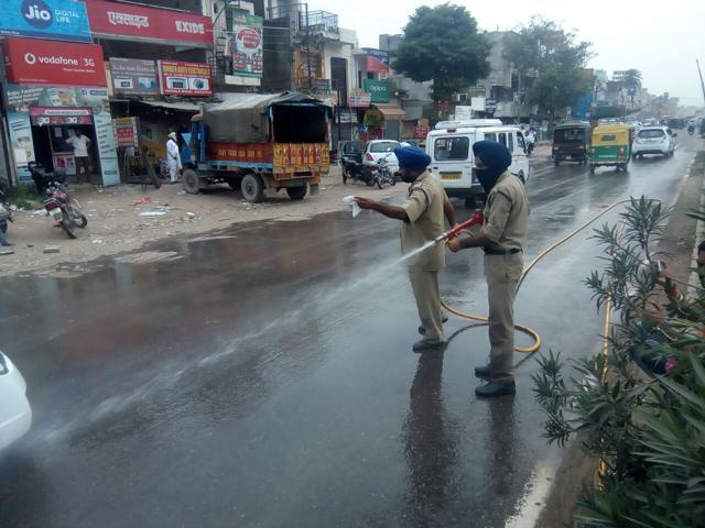 Firemen washing the road in Zirakpur on Saturday. (HT Photo) Firemen washing the road in Zirakpur on Saturday. (HT Photo)