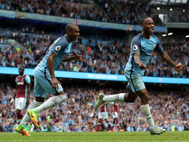 Raheem Sterling, right, celebrates with teammate Fernandinho after scoring Manchester City's third goal. (AP) Raheem Sterling, right, celebrates with teammate Fernandinho after scoring Manchester City's third goal. (AP)