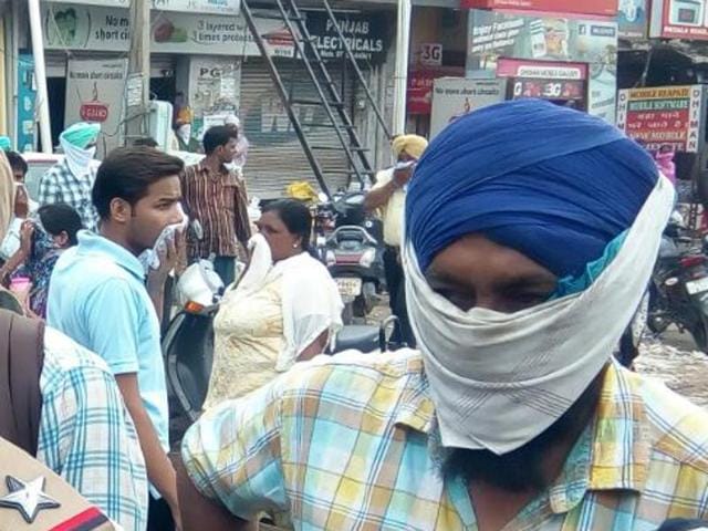 People with their faces covered after the chemical leak. (HT Photo) People with their faces covered after the chemical leak. (HT Photo)
