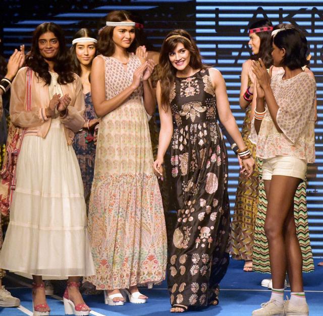 Kriti Sanon with models showcases a creation by designer Ritu Kumar at Lakme Fashion Week (LFW) Winter/Festive 2016 in Mumbai on Saturday. (PTI) Kriti Sanon with models showcases a creation by designer Ritu Kumar at Lakme Fashion Week (LFW) Winter/Festive 2016 in Mumbai on Saturday. (PTI)