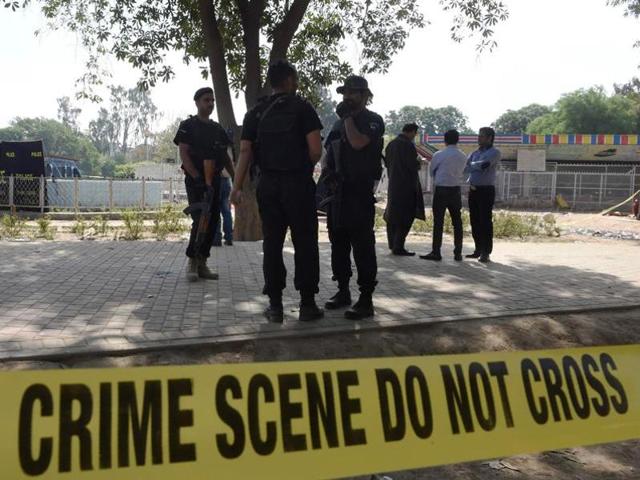 Pakistani police commandos stand guard at the suicide blast site in Lahore. (AFP File Photo) Pakistani police commandos stand guard at the suicide blast site in Lahore. (AFP File Photo)
