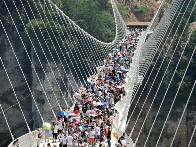 Only 8,000 people each day will be allowed to cross the bridge, according to Chinese media reports , and tourists will have to book their tickets a day in advance, at a cost of 138 yuan ($20). (REUTERS) 
