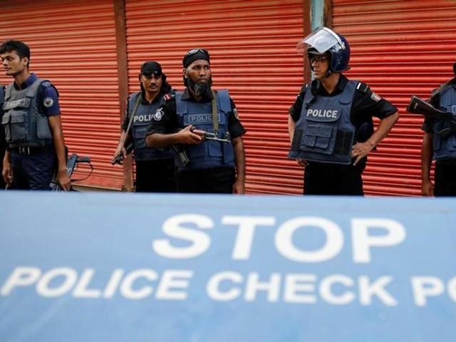 Police keep watch near the site of a gunbattle with militants on the outskirts of Dhaka, Bangladesh. (Reuters) Police keep watch near the site of a gunbattle with militants on the outskirts of Dhaka, Bangladesh. (Reuters)