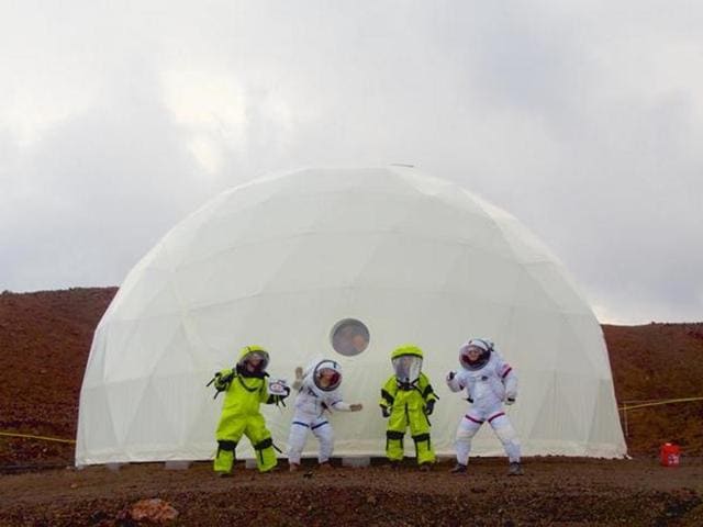 In this photo provided by the University of Hawaii, six scientists celebrate as they exit from their Mars simulation habitat on slopes of Mauna Loa on the Big Island, Hawaii on Sunday. The scientists completed a yearlong Mars simulation in Hawaii on Sunday, where they lived in the dome in near isolation. (AP) In this photo provided by the University of Hawaii, six scientists celebrate as they exit from their Mars simulation habitat on slopes of Mauna Loa on the Big Island, Hawaii on Sunday. The scientists completed a yearlong Mars simulation in Hawaii on Sunday, where they lived in the dome in near isolation. (AP)