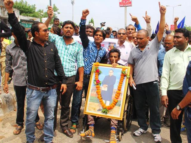 Dalits shout slogans during a protest march from Ahmedabad to Una where four Dalits were beaten(Hindustan Times) Dalits shout slogans during a protest march from Ahmedabad to Una where four Dalits were beaten(Hindustan Times)