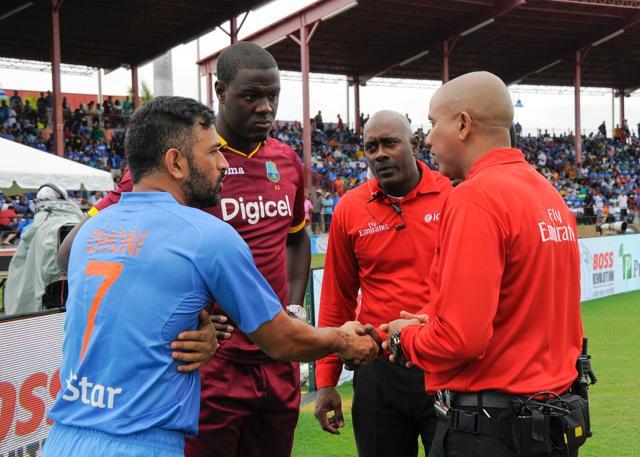 MS Dhoni and Carlos Brathwaite (2L) of West Indies agree with umpires Patrick Gustard (2R) and Joel Wilson (R) to abandon their match due to rain during the 2nd and final T20i between West Indies and India. (AFP) MS Dhoni and Carlos Brathwaite (2L) of West Indies agree with umpires Patrick Gustard (2R) and Joel Wilson (R) to abandon their match due to rain during the 2nd and final T20i between West Indies and India. (AFP)