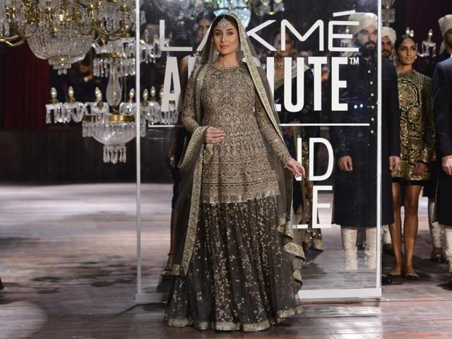 Dressed in a heavily embroided olive green lehenga and a kurti patterned choli with dupatta on her head, Kareena looked every inch of a regal bride. (IANS) Dressed in a heavily embroided olive green lehenga and a kurti patterned choli with dupatta on her head, Kareena looked every inch of a regal bride. (IANS)
