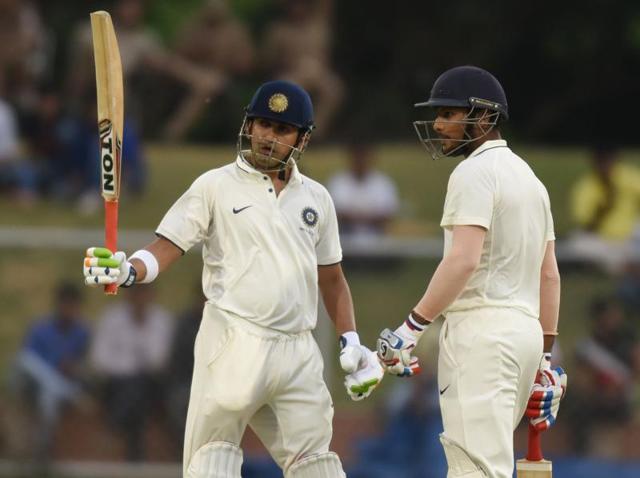 Gautam Gambhir celebrates his fifty as Mayank Agarwal watches.(Virendra Singh Gosain/HT PHOTO)