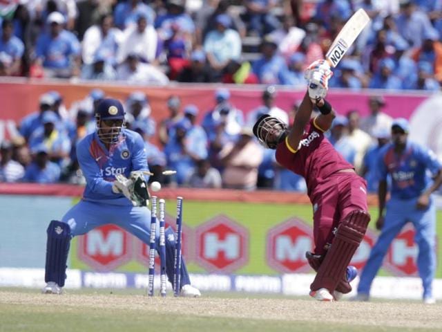 West Indies' Dwayne Bravo, right, is bowled by India's Amit Mishra.(AP Photo)