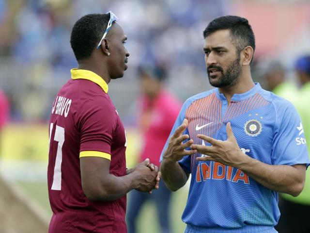 West Indies' Dwayne Bravo, left, and India's MS Dhoni, right, talk during a rain delay at the second Twenty20 . (AP Photo) West Indies' Dwayne Bravo, left, and India's MS Dhoni, right, talk during a rain delay at the second Twenty20 . (AP Photo)