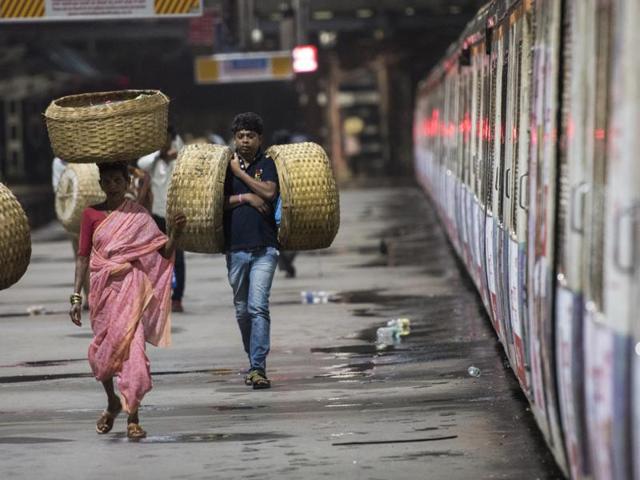 Fisherfolk arrive at CST via the first local train from Karjat to Mumbai. From here, they will collect the day’s catch from the dock and sell it at their respective markets in Mumbai on Saturday. (Pratik Chorge/HT ) 