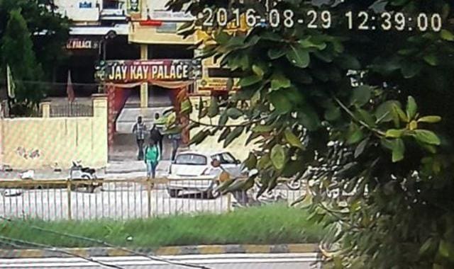 CCTV footage showing the dacoits coming out of the Manappuram Finance Company office after the loot in Jalandhar on Monday. (HT Photo)