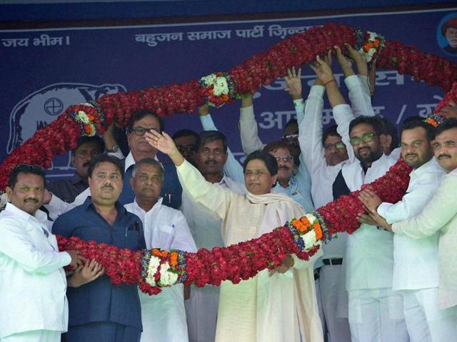 Bahujan Samaj Party chief Mayawati is garlanded at a mega rally in Azamgarh on Sunday. \(PTI Photo) Bahujan Samaj Party chief Mayawati is garlanded at a mega rally in Azamgarh on Sunday. \(PTI Photo)