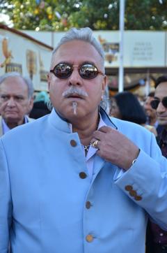 Vijay Mallya on his way to attend a Parliament session. His lawyer said that since there is no settlement happening with the banks, they cannot ask him to disclose his assets(Hindustan Times)