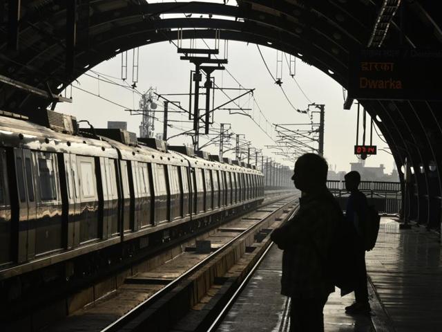 Passengers waiting for the first Metro train, which runs from Dwarka to Vaishali, at the Blue Line in New Delhi on Monday. (Arun Sharma/HT PHOTO) 