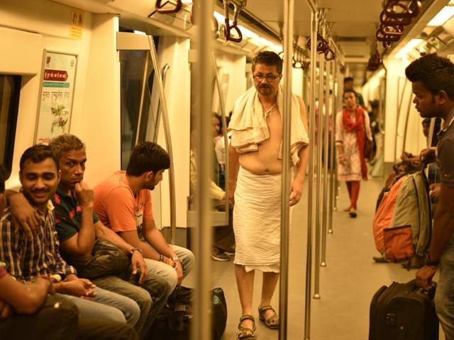 A man dressed in traditional Bengali attire on the Blue Line, which runs from Dwarka to Vaishali in New Delhi on Monday. (Arun Sharma/HT ) 