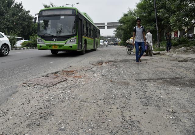 The condition of road near Maharani Bagh bus stop. (S Burmaula / HT Photo)