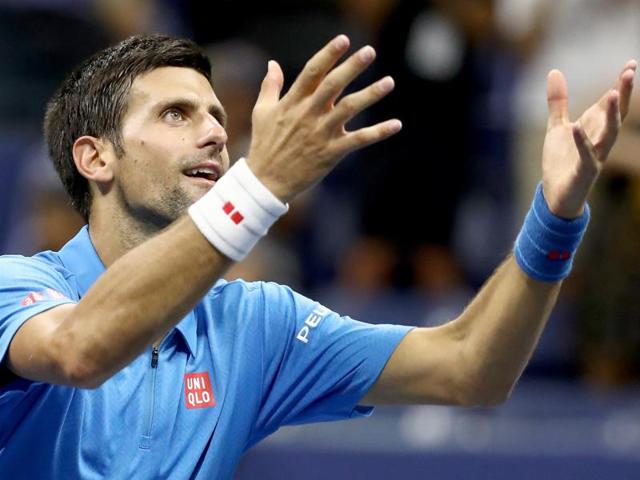 Novak Djokovic celebrates defeating Jerzy Janowicz. (AFP photo) 