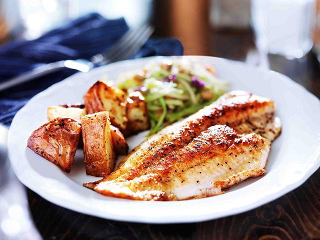 Pan-fried fillet of Bekti fish, fettucine of spice tempered vegetables and cumin roasted potatoes. (Catch Spices)