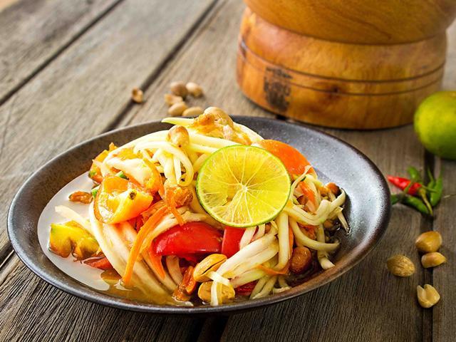 Thai raw papaya salad with tamarind and chat masala. (Catch Spices)