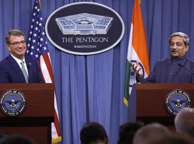 US defence secretary Ash Carter listens at left as defence minister Manohar Parrikar speaks during their joint news conference at the Pentagon.(AP)
