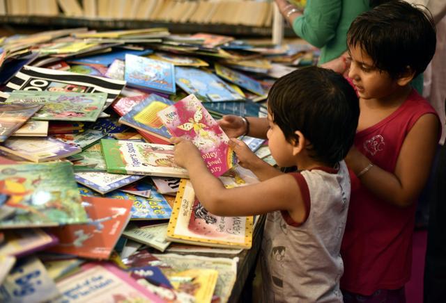 Kids browse through books at the Delhi Book Fair. (Arun Sharma/HT Photo) Kids browse through books at the Delhi Book Fair. (Arun Sharma/HT Photo)