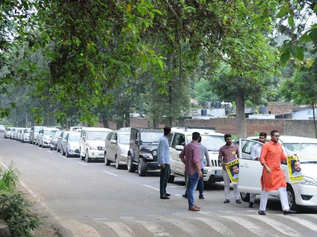 Members of Student Organisation of Panjab University during the car rally at Panjab University, Chandigarh on Monday.(Anil Dayal/HT Photo)