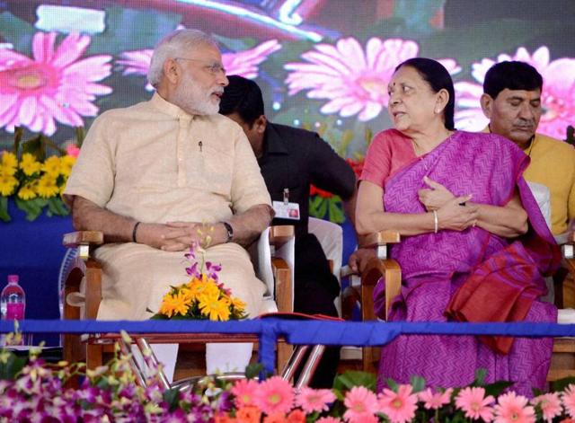 Prime Minister Narendra Modi with former Gujarat CM Anandiben Patel at the inauguration of the first phase of Saurashtra Narmada Avataran for Irrigation (SAUNI) project in Rajkot on Tuesday. (PTI) Prime Minister Narendra Modi with former Gujarat CM Anandiben Patel at the inauguration of the first phase of Saurashtra Narmada Avataran for Irrigation (SAUNI) project in Rajkot on Tuesday. (PTI)
