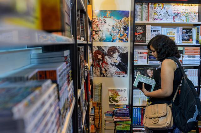 A woman browses through books at the Delhi Book Fair at Pragati Maidan. (AFP Photo) A woman browses through books at the Delhi Book Fair at Pragati Maidan. (AFP Photo)