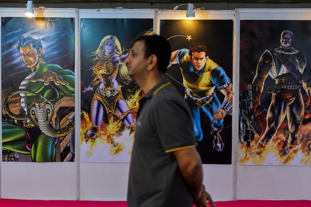 A visitor walks past a display at the Delhi Book Fair. (AFP Photo) A visitor walks past a display at the Delhi Book Fair. (AFP Photo)