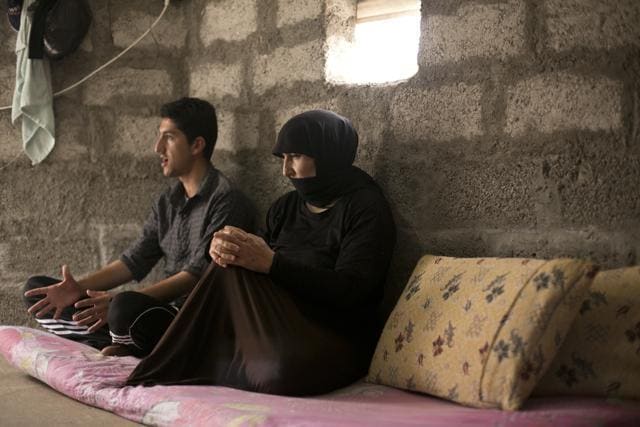 In this May 18, 2016 photo, Nouri and her son speak to the Associated Press at Kankhe Camp for the internally displaced in Dahuk, northern Iraq. Her husband, Murat Mahmoud, was killed on Aug. 3, 2014, by Islamic State militants in a massacre of Yazidis. (AP) In this May 18, 2016 photo, Nouri and her son speak to the Associated Press at Kankhe Camp for the internally displaced in Dahuk, northern Iraq. Her husband, Murat Mahmoud, was killed on Aug. 3, 2014, by Islamic State militants in a massacre of Yazidis. (AP)