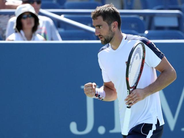 Marin Cilic of Croatia reacts to a break point against Roger Dutra Silva of Brazil. (AFP Photo) 