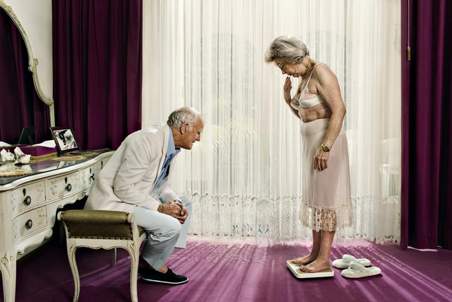 Karan Kapoor won the International Photography Award in 2009 for this image, titled ‘Old Couple’, showing an aged man smiling and looking on as his wife steps on to a weighing scale in their elegant bedroom. Karan Kapoor won the International Photography Award in 2009 for this image, titled ‘Old Couple’, showing an aged man smiling and looking on as his wife steps on to a weighing scale in their elegant bedroom.