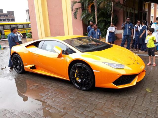 THE BJP MLA gifting a mini version of the Lamborghini to his wife before presenting her the car(HT Photo)