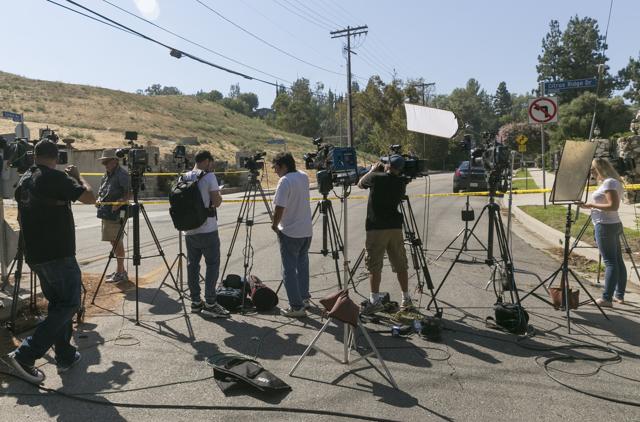 Members of the media wait outside singer Chris Brown's house in the Tarzana neighbourhood of Los Angeles. (AP) Members of the media wait outside singer Chris Brown's house in the Tarzana neighbourhood of Los Angeles. (AP)