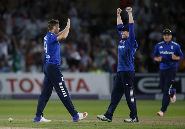 Chris Woakes and Eoin Morgan (R) celebrate winning the match and the series. (REUTERS) Chris Woakes and Eoin Morgan (R) celebrate winning the match and the series. (REUTERS)