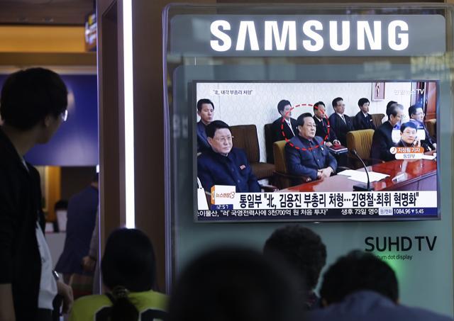 People watch a TV screen showing a file image of Kim Yong Jin, center, a vice premier on education affairs in North Korea's cabinet. (AP) People watch a TV screen showing a file image of Kim Yong Jin, center, a vice premier on education affairs in North Korea's cabinet. (AP)