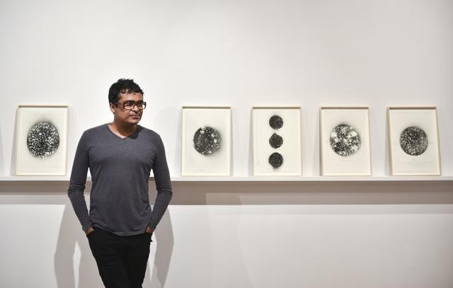 Jitish Kallat with his exhibit, Rain Study (the hour of the day of the month of the season) (Photo: Aalok Soni/HT )