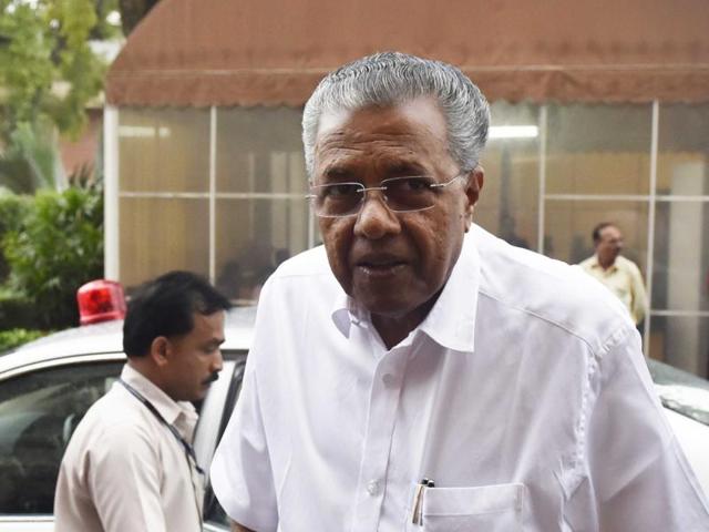 Kerala chief minister Pinarayi Vijayan is in favour of development and technology. But every now and then the communist leader in Vijayan towers over the chief minister he is.(PTI)