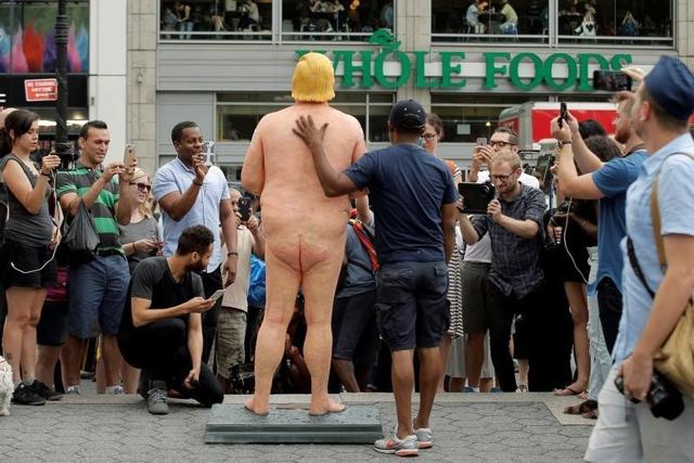 People photograph a naked statue of Republican US presidential nominee Donald Trump that was left in Union Square Park in New York City, US. (Reuters) People photograph a naked statue of Republican US presidential nominee Donald Trump that was left in Union Square Park in New York City, US. (Reuters)