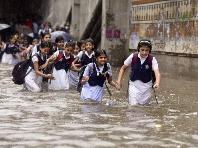 The weather department says 53 mm of rain was recorded in Delhi-NCR in just two hours. The “unusual” amount of rains caught this group of school students off guard. (Raj K Raj/HT PHOTO) The weather department says 53 mm of rain was recorded in Delhi-NCR in just two hours. The “unusual” amount of rains caught this group of school students off guard. (Raj K Raj/HT PHOTO)