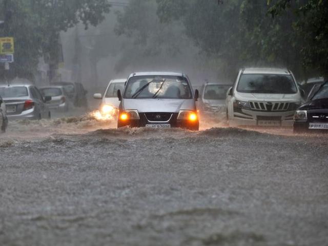 Office-goers had an especially tough time with packed buses, almost no autos on the road and peaking cab fares. No, that’s not a river but a flooded road in Patel Nagar, central Delhi. (Sanchit Khanna/HT Photo) Office-goers had an especially tough time with packed buses, almost no autos on the road and peaking cab fares. No, that’s not a river but a flooded road in Patel Nagar, central Delhi. (Sanchit Khanna/HT Photo)